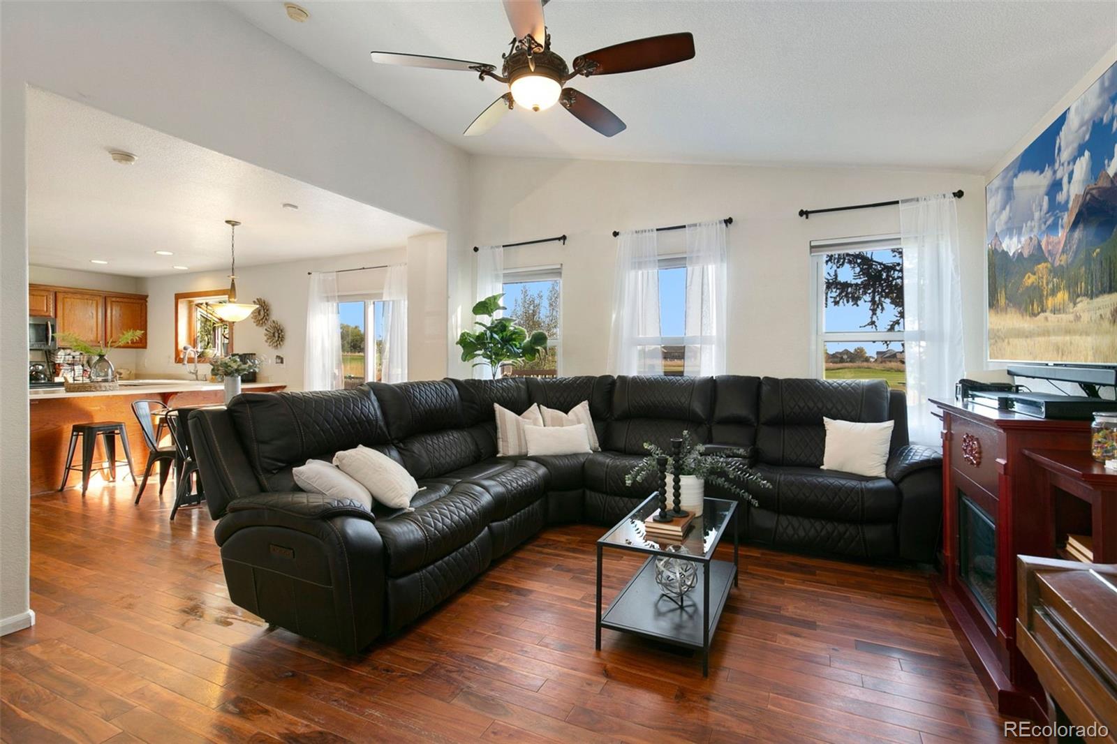 1606 Conestoga Drive Fort Lupton, CO 80621 - Photo 5 of 25 a living room with furniture and wooden floor