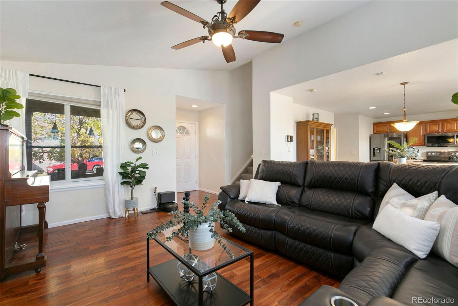 1606 Conestoga Drive Fort Lupton, CO 80621 - Photo 6 of 25 a living room with furniture and a large window