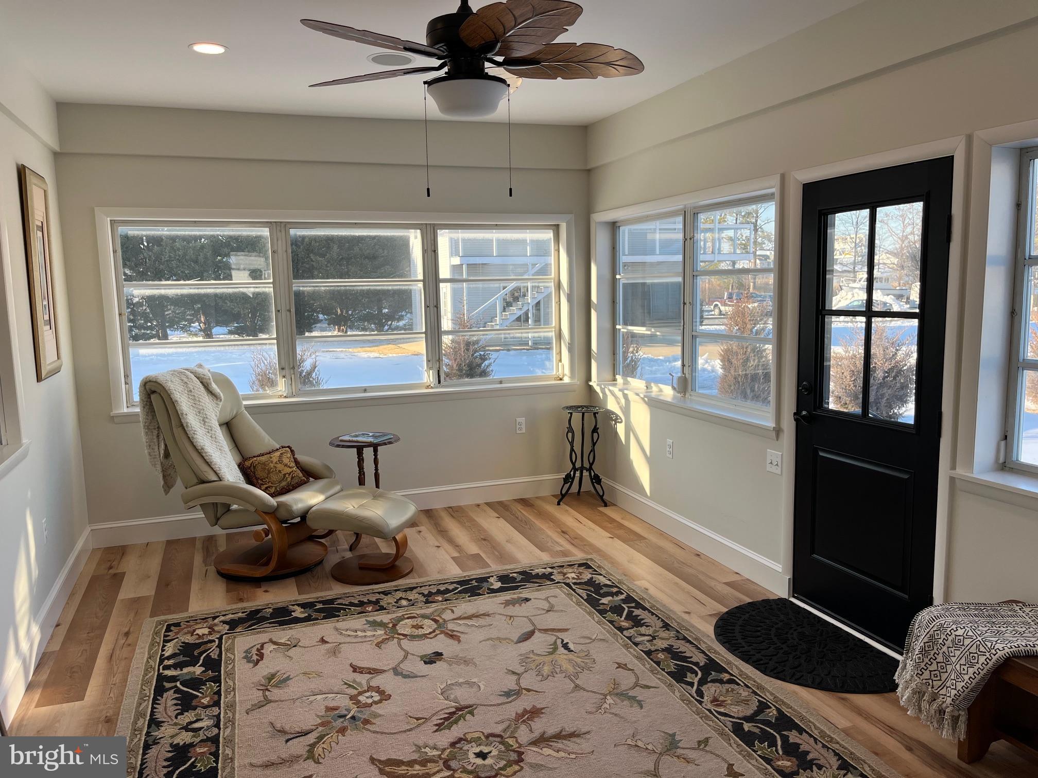 21560 Chicken Point Road Tilghman, MD 21671 - Photo 14 of 25 a living room with furniture and a floor to ceiling window
