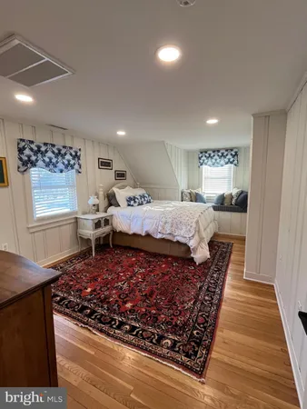 a kitchen with stainless steel appliances granite countertop a stove a sink and a refrigerator with wooden cabinets