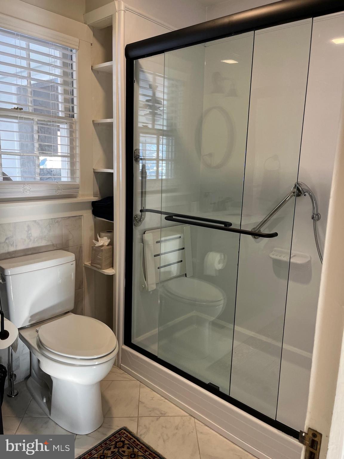 21560 Chicken Point Road Tilghman, MD 21671 - Photo 23 of 25 a bathroom with a toilet and a shower