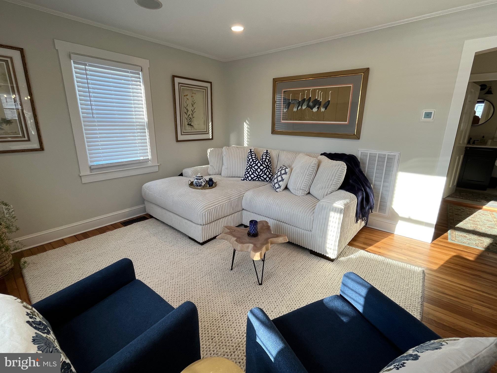 21560 Chicken Point Road Tilghman, MD 21671 - Photo 10 of 25 a living room with furniture and a window