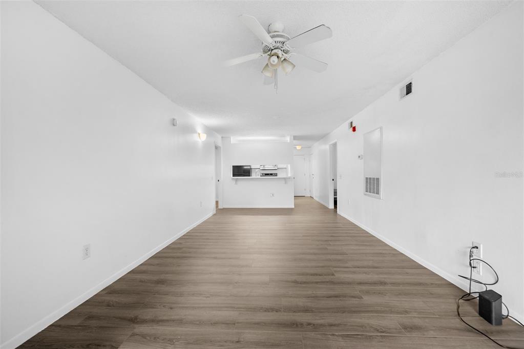 3921 Southwest 34th Street, Unit 208 Gainesville, FL 32608 - Photo 5 of 33 a view of an empty room with wooden floor