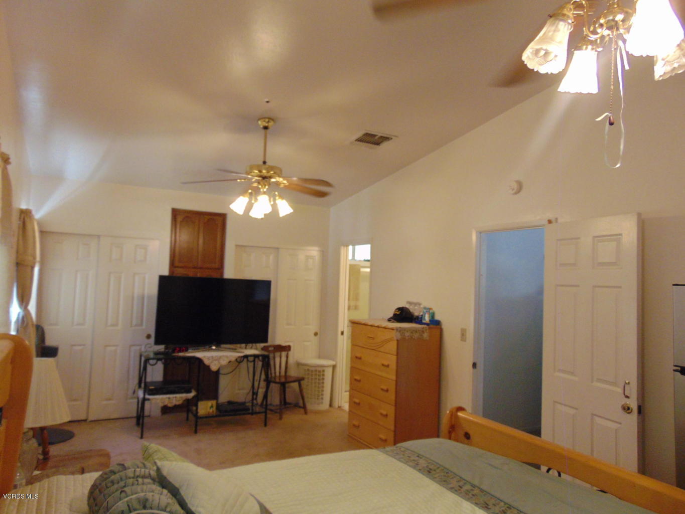 34440 Red Rover Mine Road Acton, CA 93510 - Photo 15 of 39 a living room with furniture a flat screen tv and a chandelier