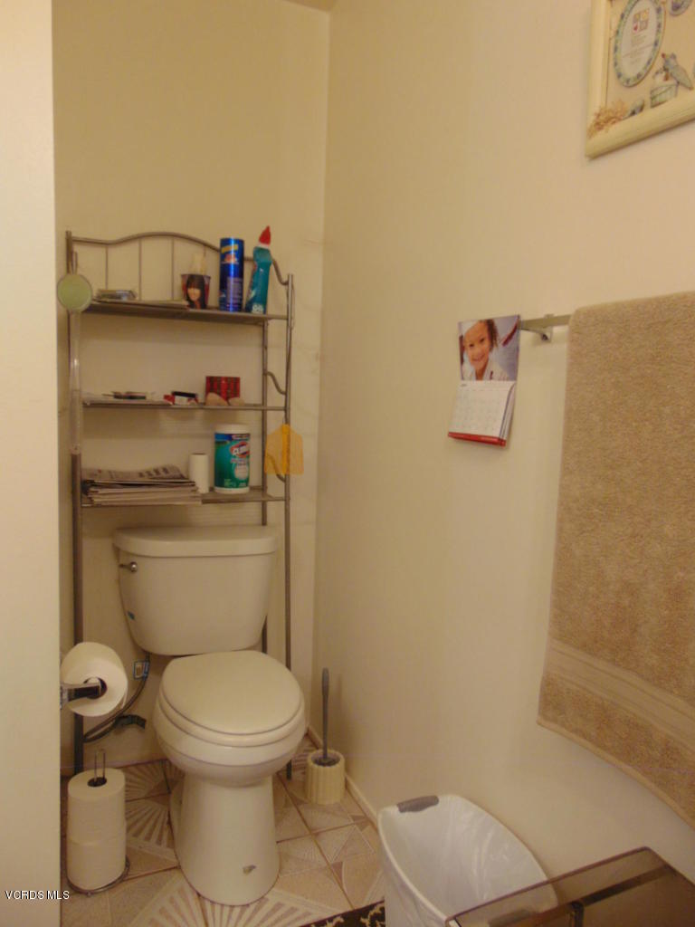 34440 Red Rover Mine Road Acton, CA 93510 - Photo 18 of 39 a bathroom with a toilet and a shower curtain