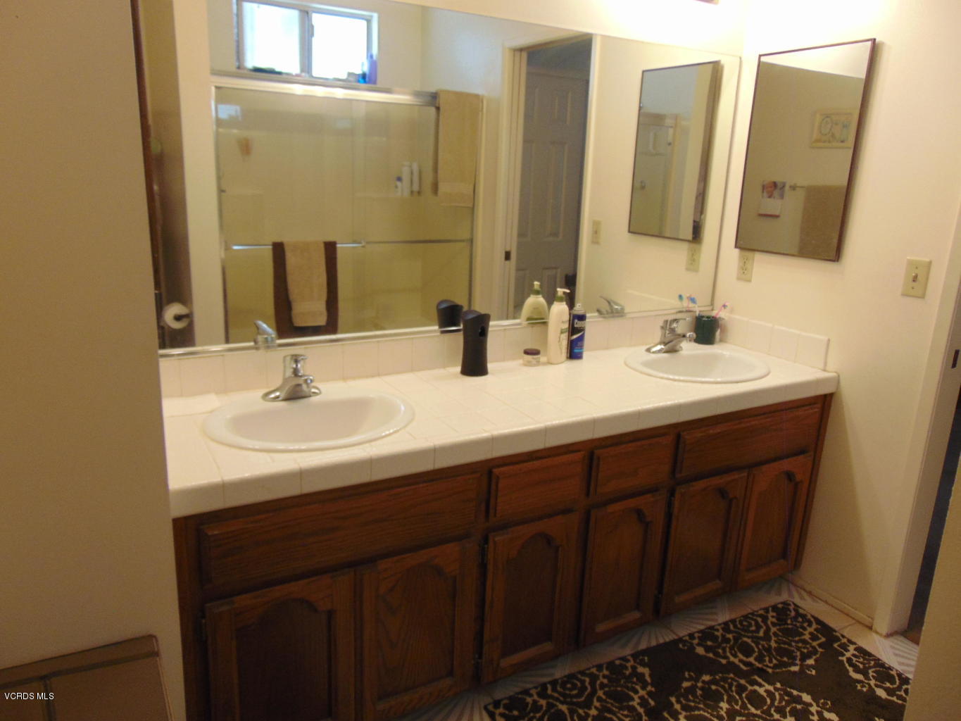 34440 Red Rover Mine Road Acton, CA 93510 - Photo 19 of 39 a bathroom with double sink and a mirror