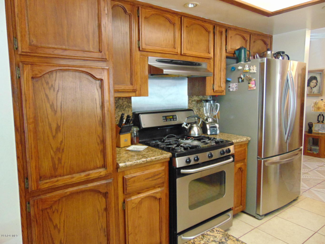 34440 Red Rover Mine Road Acton, CA 93510 - Photo 5 of 39 a kitchen with a refrigerator stove and cabinets