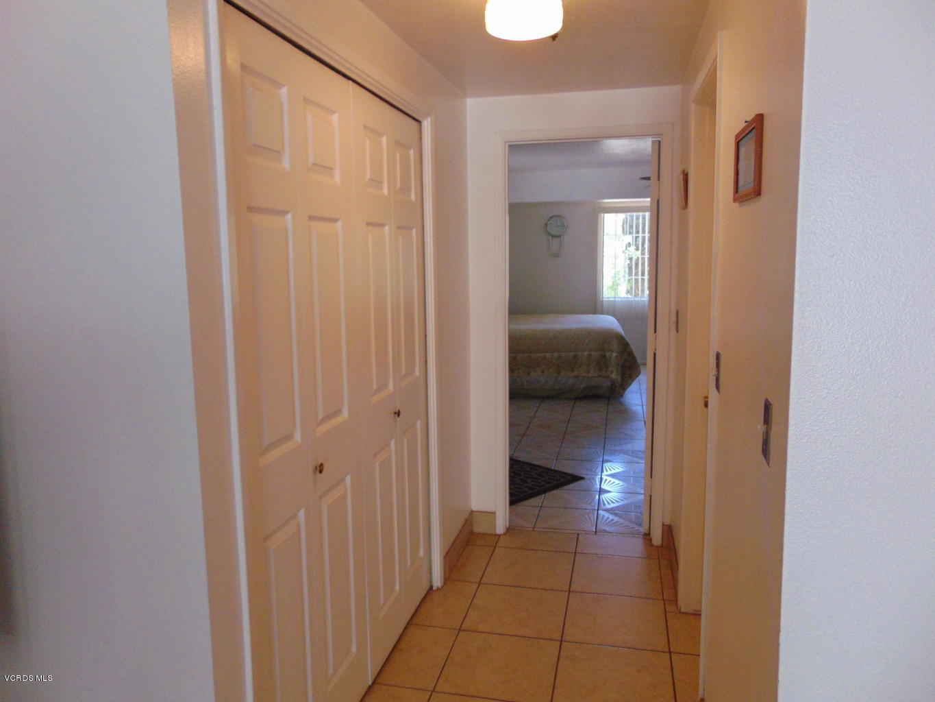 34440 Red Rover Mine Road Acton, CA 93510 - Photo 8 of 39 a view of a hallway and a livingroom and a bathroom