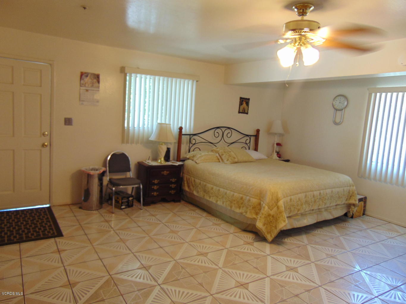 34440 Red Rover Mine Road Acton, CA 93510 - Photo 10 of 39 a bedroom with a bed and a chandelier