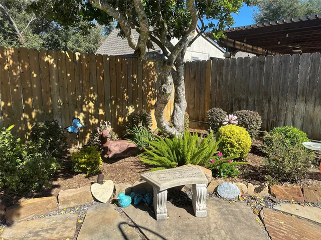 a garden view with a seating space