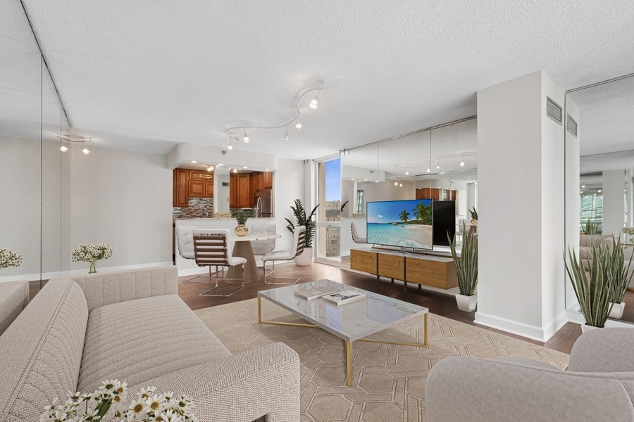 200 North Dearborn Street, Unit 2402 Chicago, IL 60601 - Photo 4 of 22 a living room with furniture and a flat screen tv