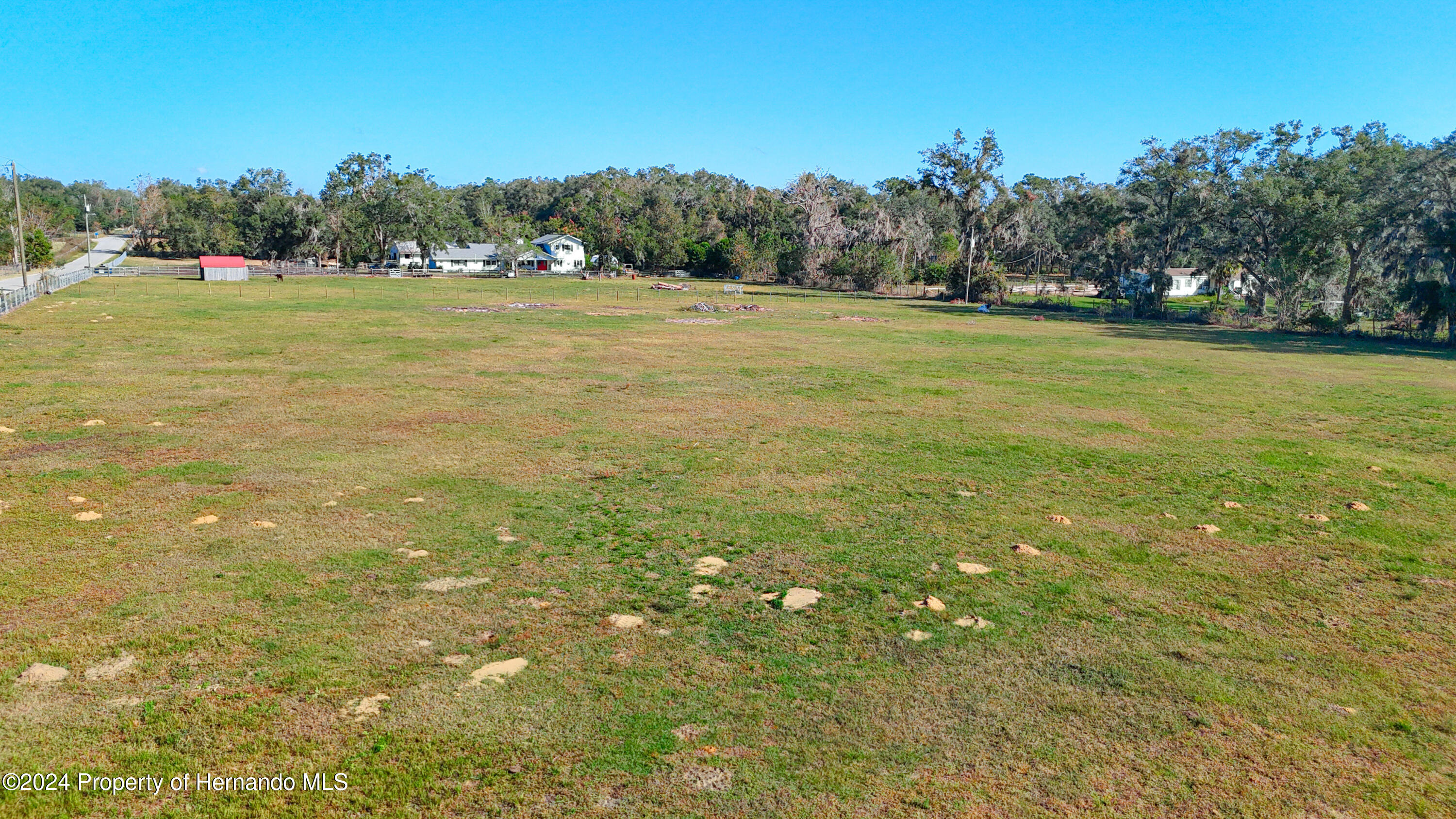 0 Old Trilby Road Brooksville, FL 34602 - Photo 23 of 37 a view of field with trees in the background