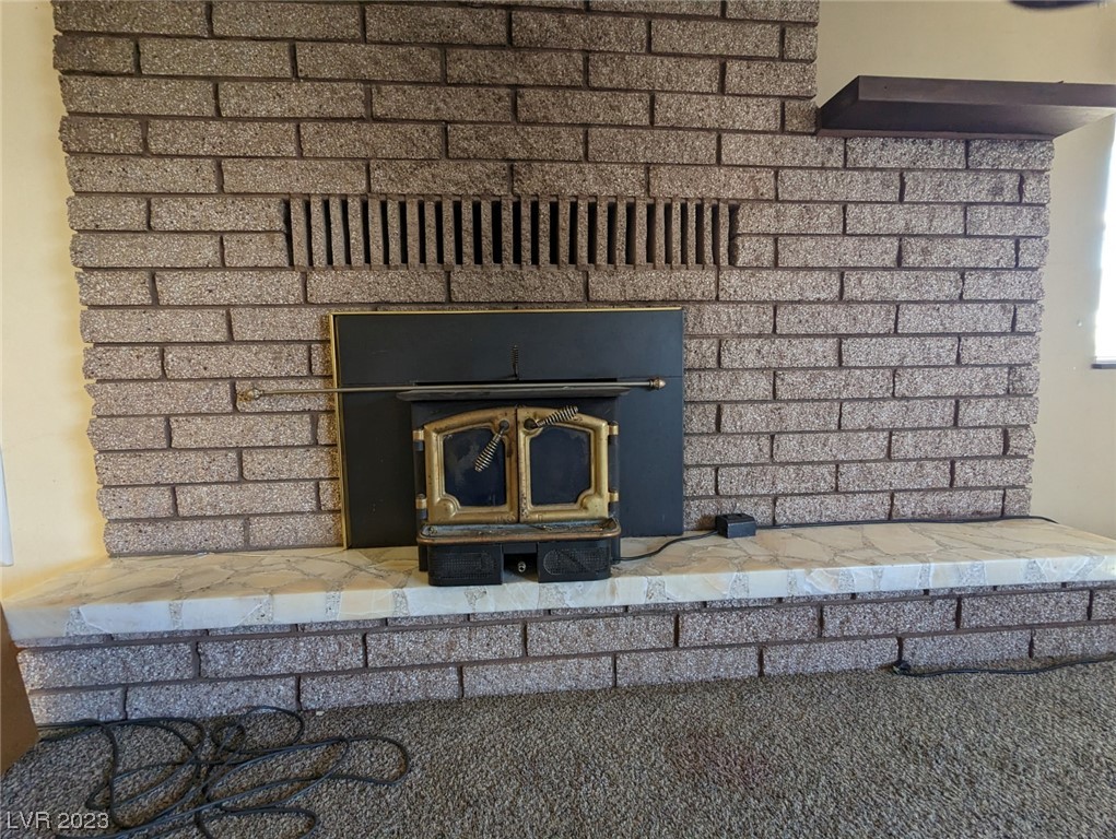 158 Lightner Street Pioche, NV 89043 - Photo 7 of 30 Min Floor - Living Room Fireplace