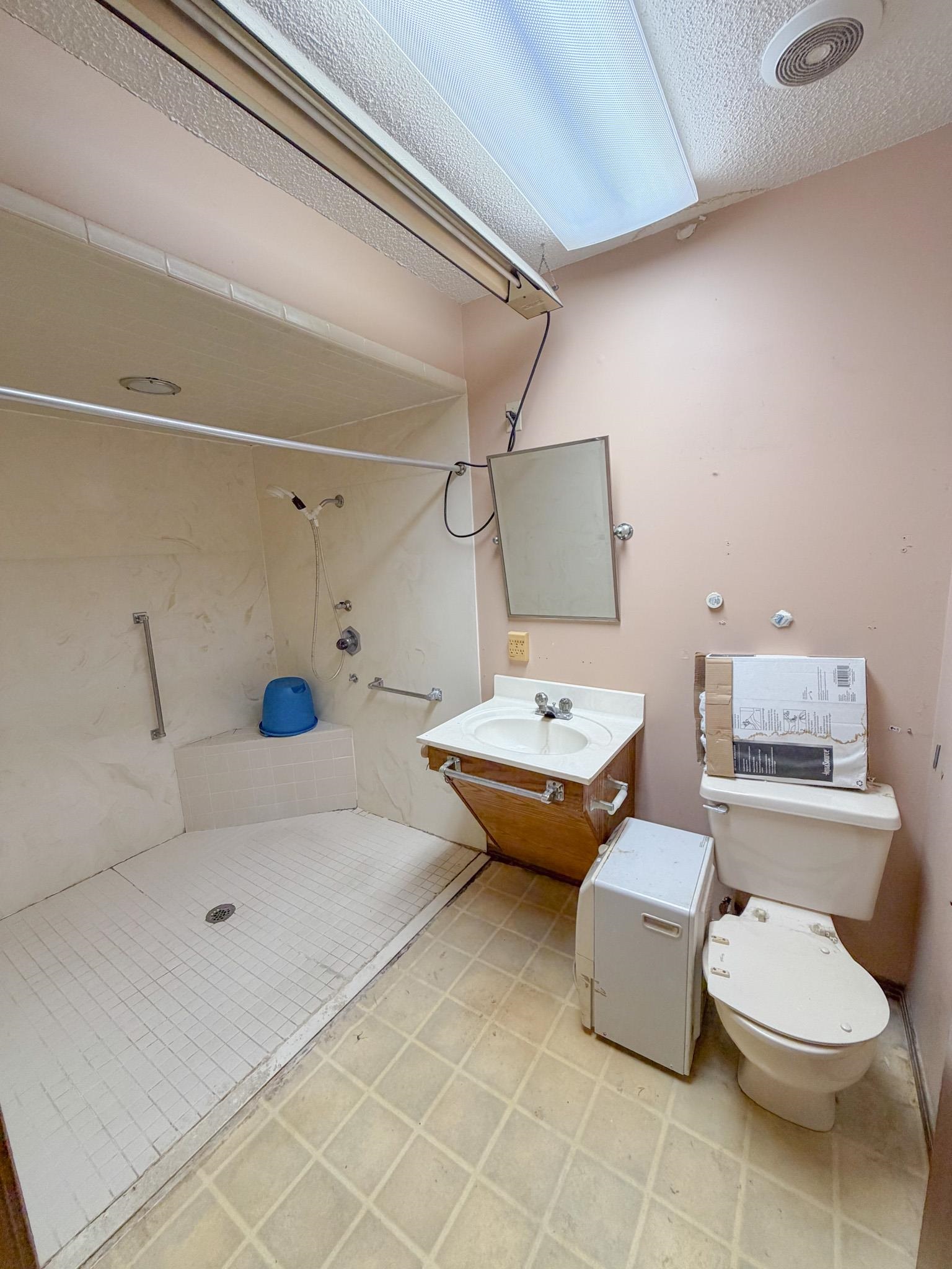 376 2nd Street Belmont, MS 38827 - Photo 11 of 29 a bathroom with a sink toilet and shower