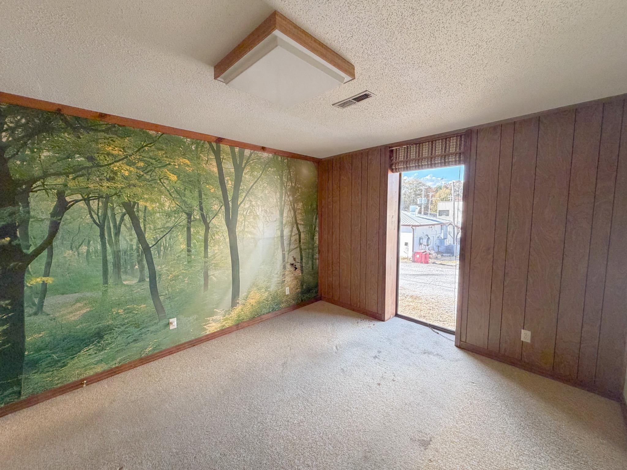 376 2nd Street Belmont, MS 38827 - Photo 13 of 29 wooden floor in an empty room with a window