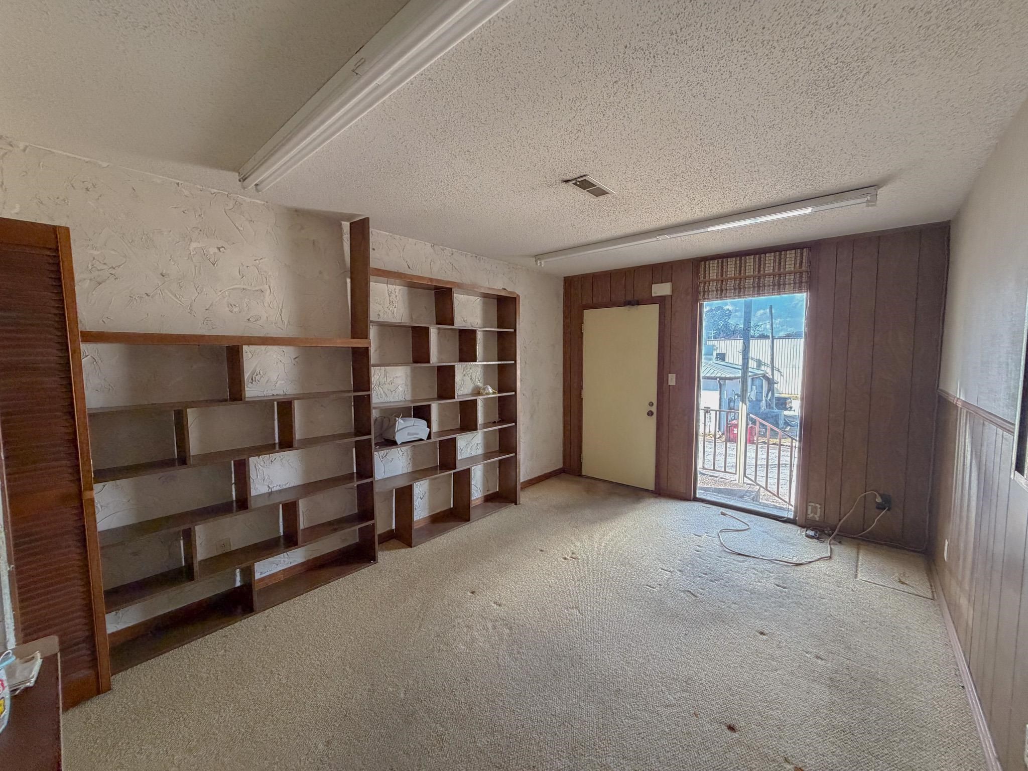 376 2nd Street Belmont, MS 38827 - Photo 24 of 29 a view of an empty room with cabinet and windows