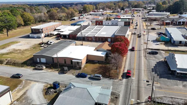 an aerial view of a houses with yard