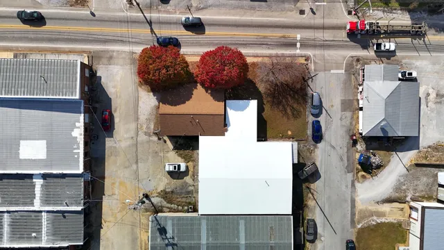 an aerial view of a house with a garden