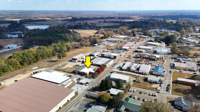 an aerial view of a house with a swimming pool
