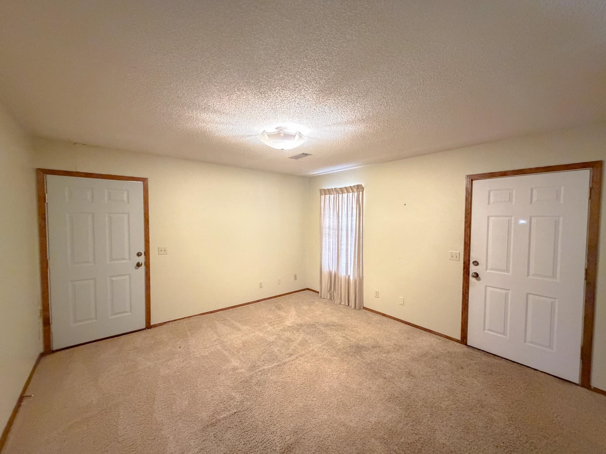 376 2nd Street Belmont, MS 38827 - Photo 10 of 29 an empty room with a empty space and windows