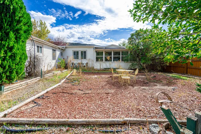 a backyard of a house with seating space