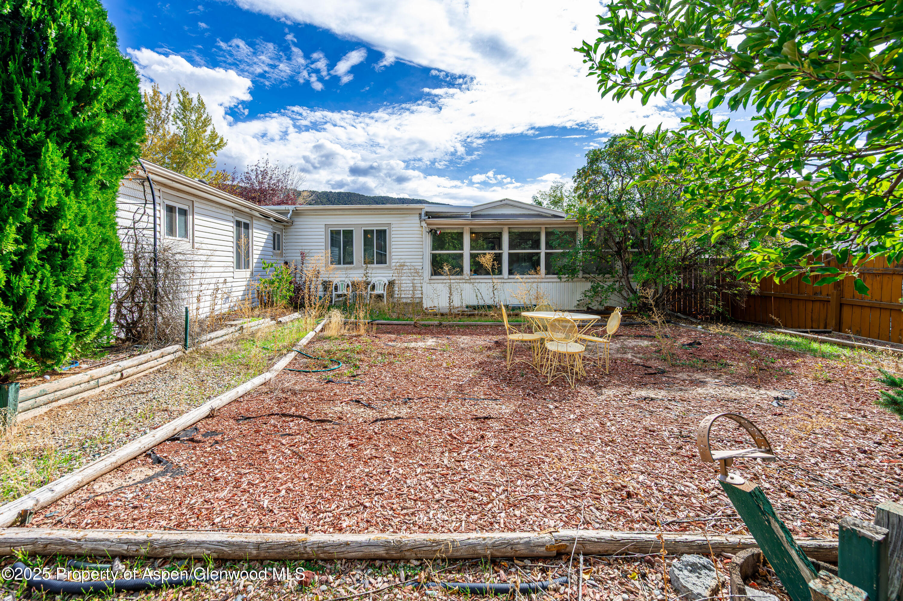 45 West Tamarack Circle Parachute, CO 81635 - Photo 20 of 23 a backyard of a house with seating space
