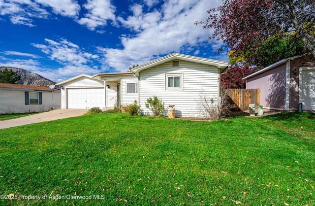 a view of a house with a yard