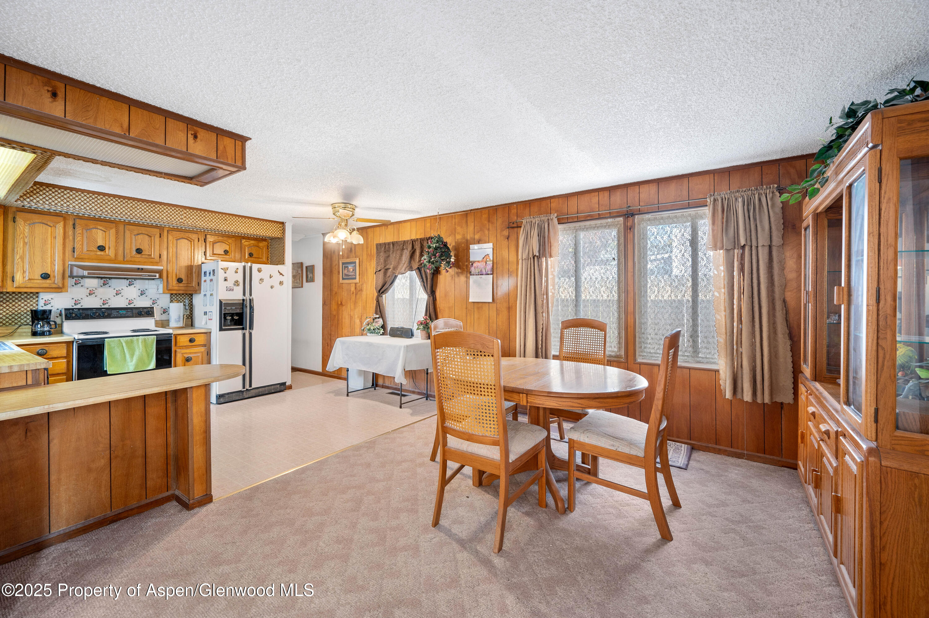 45 West Tamarack Circle Parachute, CO 81635 - Photo 5 of 23 a dining room with furniture and large window