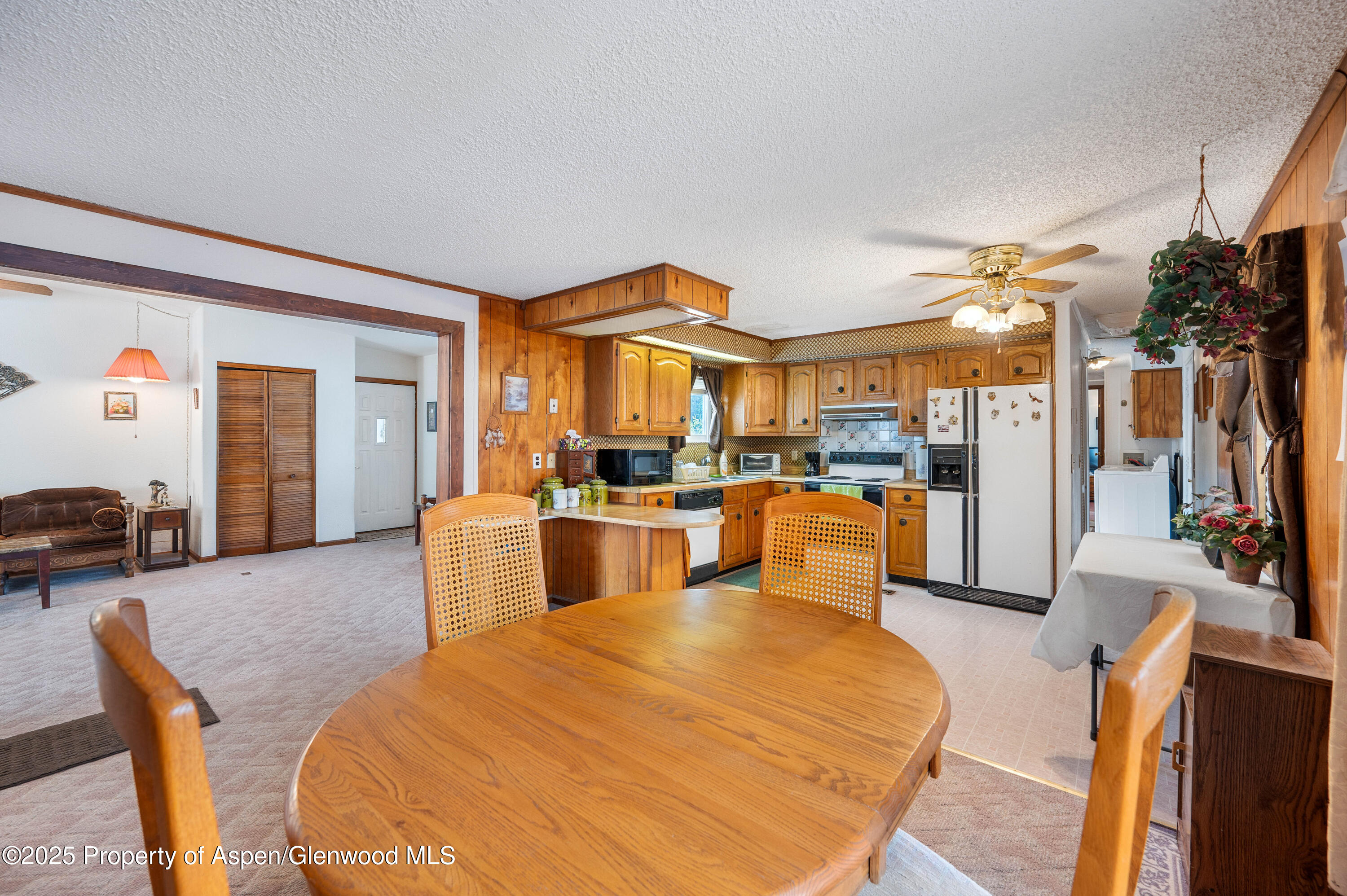45 West Tamarack Circle Parachute, CO 81635 - Photo 6 of 23 a living room with patio furniture and a flat screen tv
