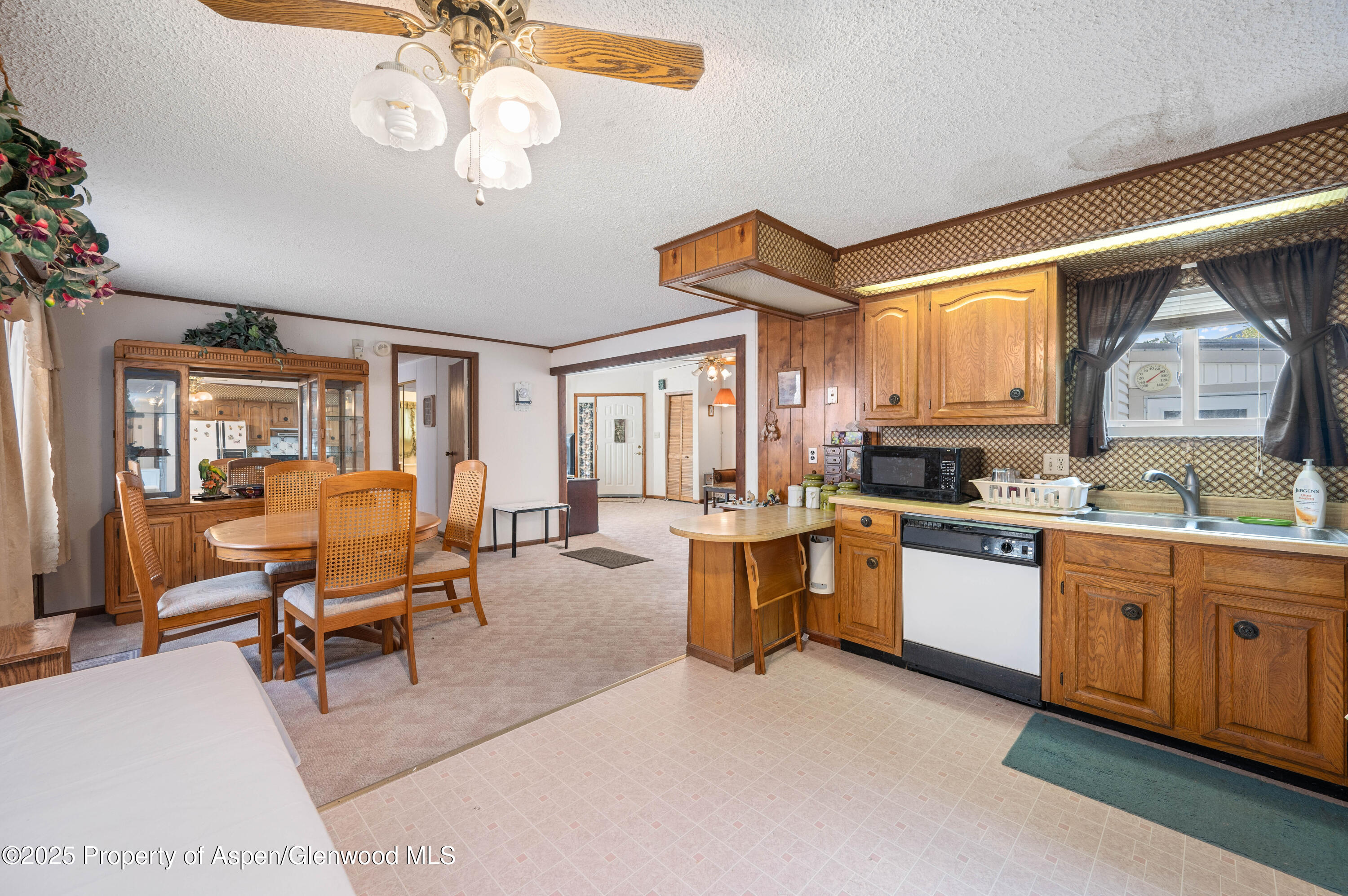 45 West Tamarack Circle Parachute, CO 81635 - Photo 8 of 23 a living room with furniture a dining table and chairs