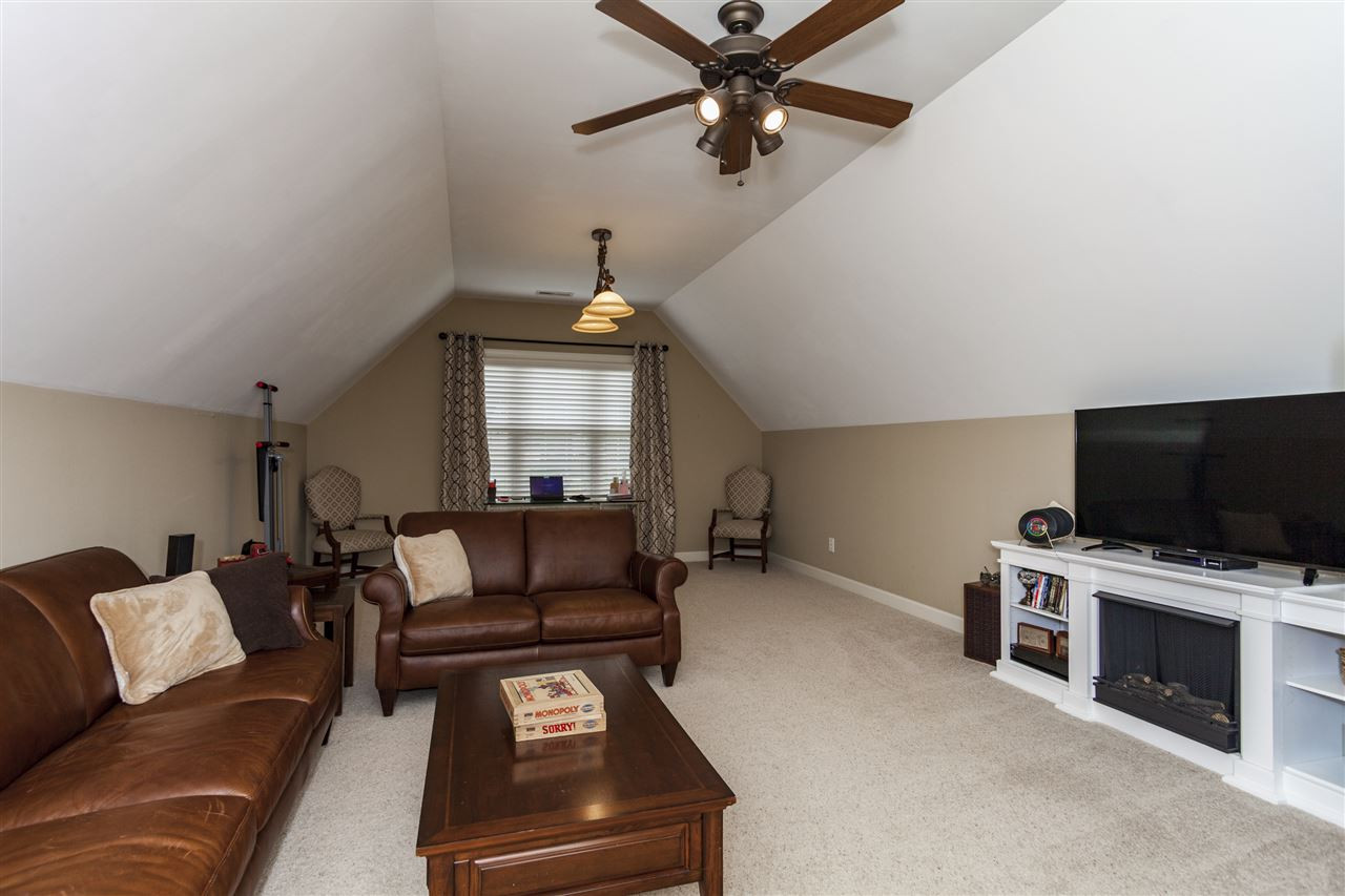 1700 Struble Circle Willow Spring, NC 27592 - Photo 18 of 25 This room offers so much space, sun filled room, and neutral plush carpeting. Huge Recreational Room