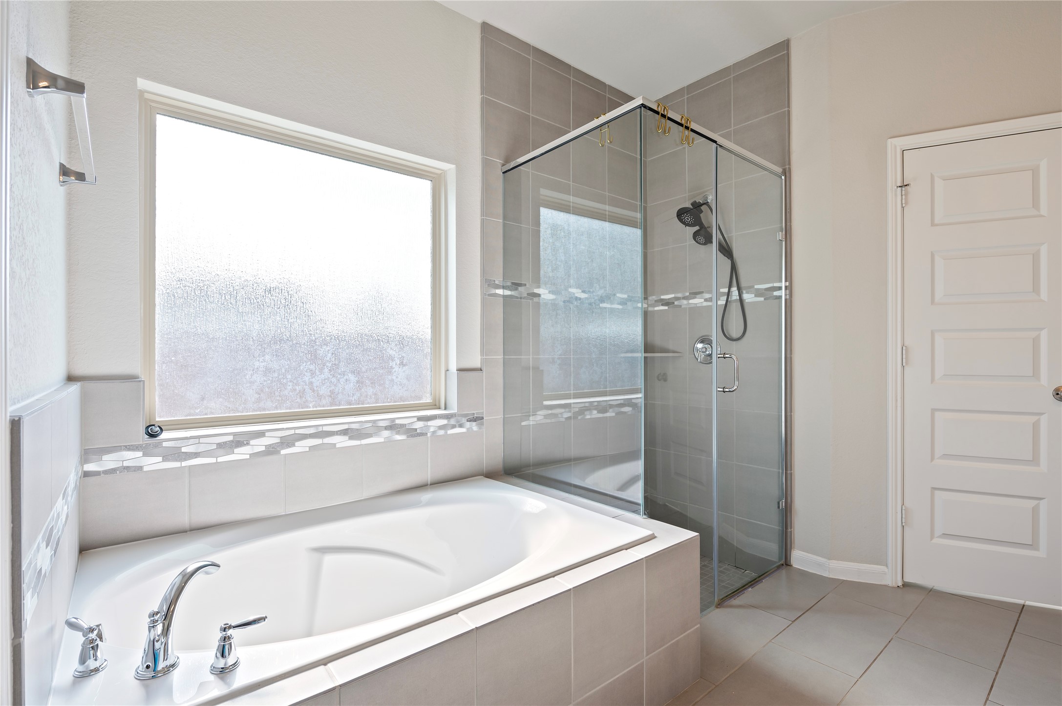 7802 Bellwick Court Pasadena, TX 77505 - Photo 23 of 37 a bathroom with a bathtub and a shower