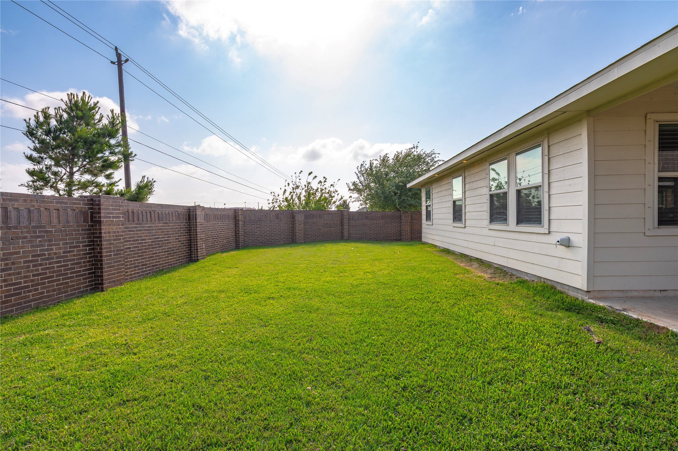 7802 Bellwick Court Pasadena, TX 77505 - Photo 31 of 37 a view of a backyard with a garden