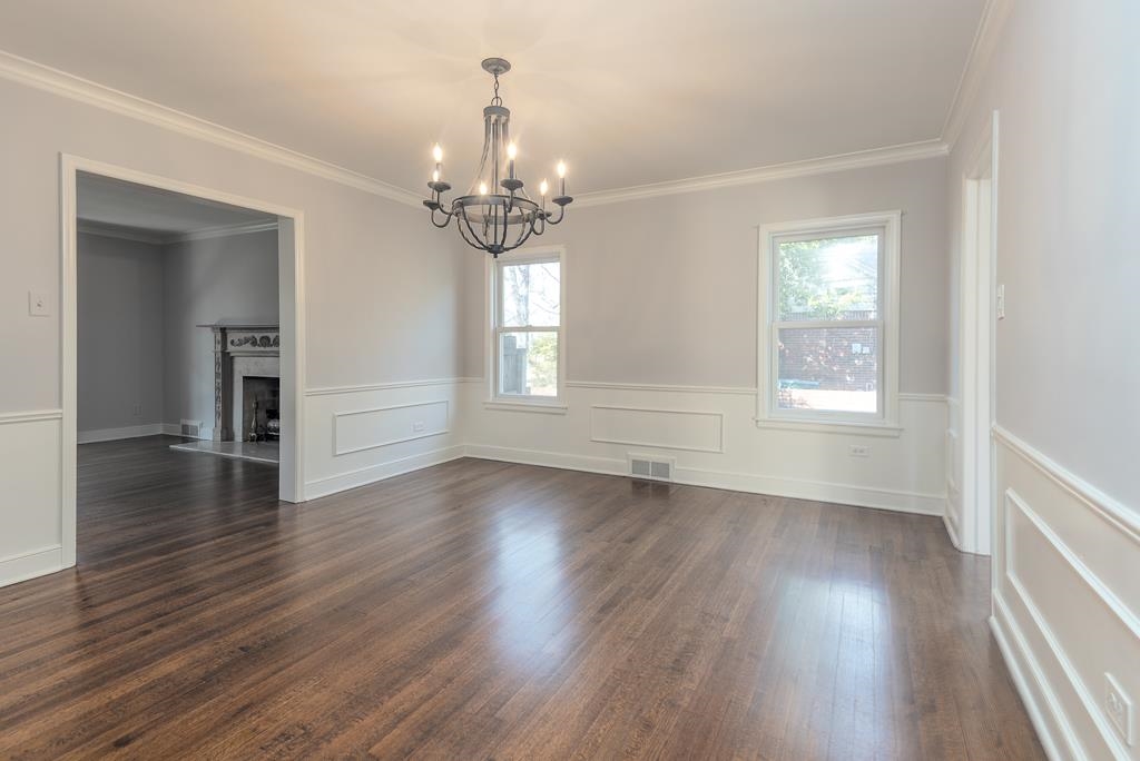 500 Colonial Road Memphis, TN 38117 - Photo 18 of 35 a view of an empty room with wooden floor and a window