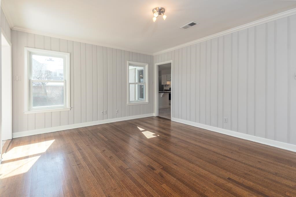 500 Colonial Road Memphis, TN 38117 - Photo 23 of 35 an empty room with wooden floor and windows