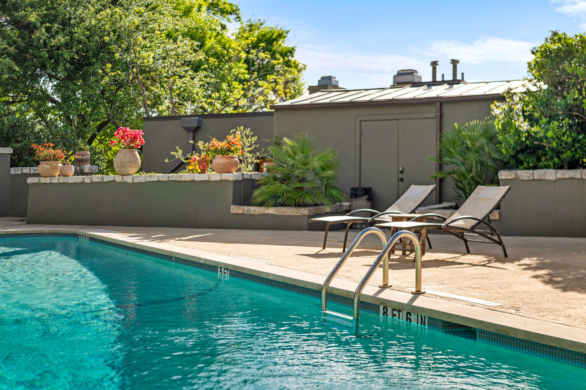 1111 West 12th Street, Unit 107 Austin, TX 78703 - Photo 9 of 38 Outdoor swimming pool with concrete decking