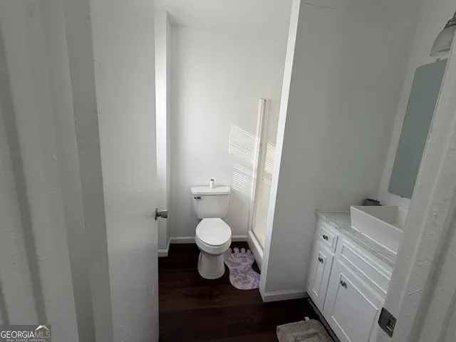 a bathroom with a toilet and a sink