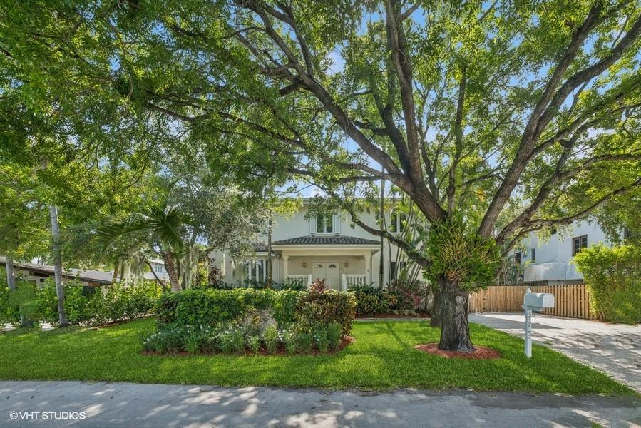 375 Ridgewood Road Key Biscayne, FL 33149 - Photo 1 of 77 a front view of a house with a garden