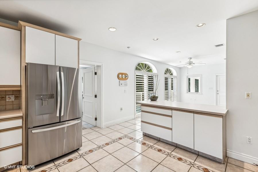 375 Ridgewood Road Key Biscayne, FL 33149 - Photo 23 of 77 a kitchen with stainless steel appliances a refrigerator and a sink