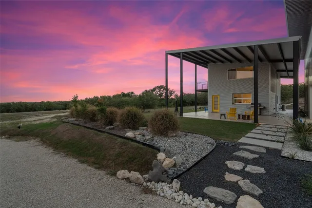 a view of a backyard with sitting area