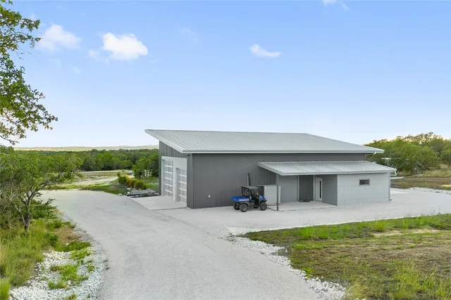 an aerial view of residential house with outdoor space