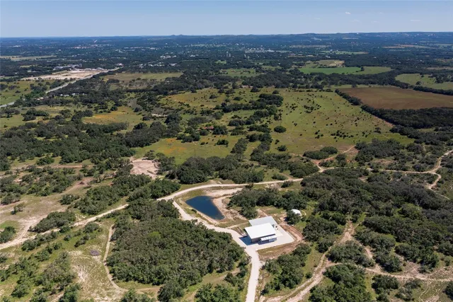 a view of a lake with a yard