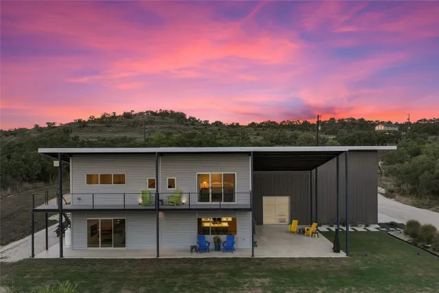 a view of a outdoor kitchen with a lake view