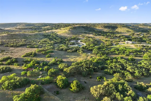 a view of a lake with houses in the back