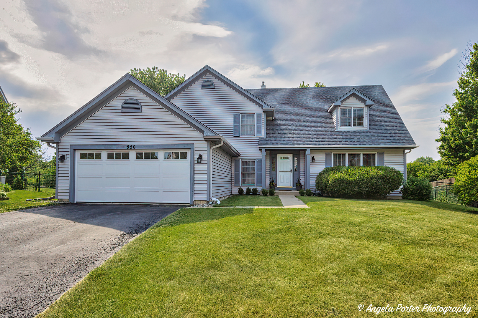 550 Flora Drive Algonquin, IL 60102 - Photo 1 of 1 a front view of a house with a yard and garage