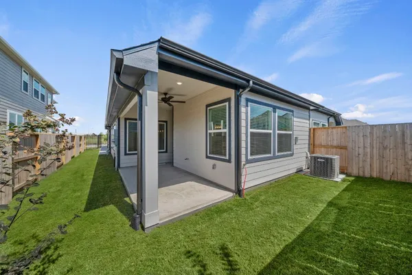 a view of an house with backyard porch and furniture