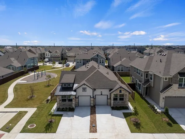 an aerial view of a house with a garden