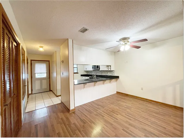 a view of a kitchen from the hallway