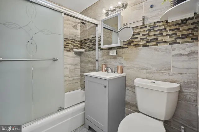 a bathroom with a toilet and shower