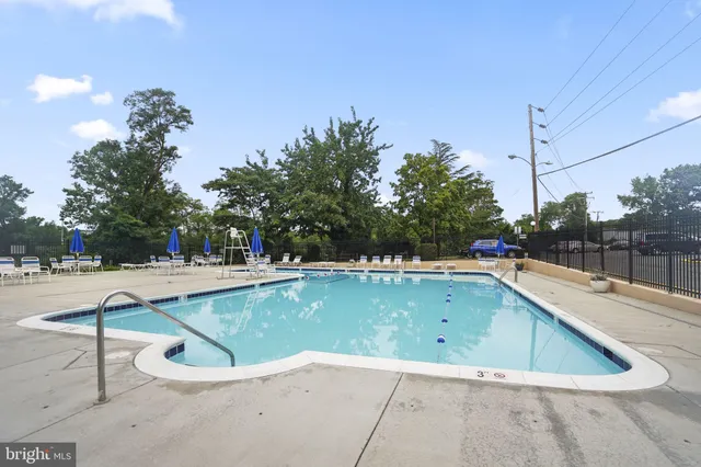 a view of a swimming pool with a lounge chairs